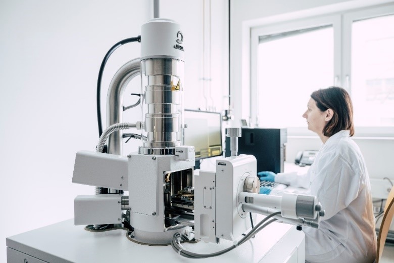 Scanning Electron Microscope (SEM) with EDS for high-resolution imaging and chemical element analysis of multilayer structures.