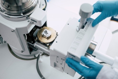 Scanning Electron Microscope (SEM) with EDS for high-resolution imaging and chemical element analysis of multilayer structures.