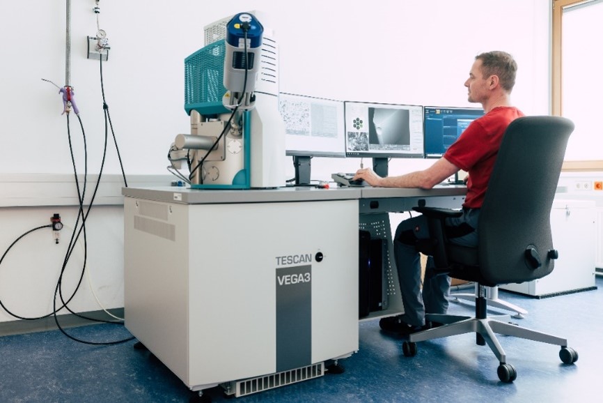 Scanning Electron Microscope (SEM) with EDS for high-resolution imaging and chemical element analysis of multilayer structures.