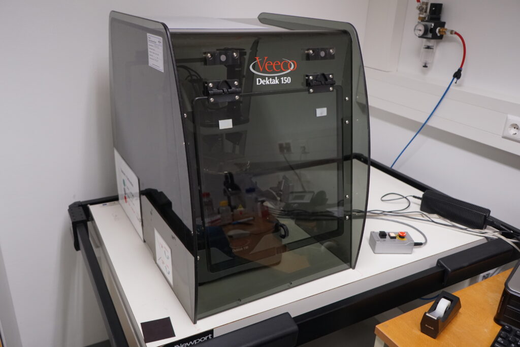 Stylus surface profilometer with diamond tip for measuring topography and roughness on large sample areas.