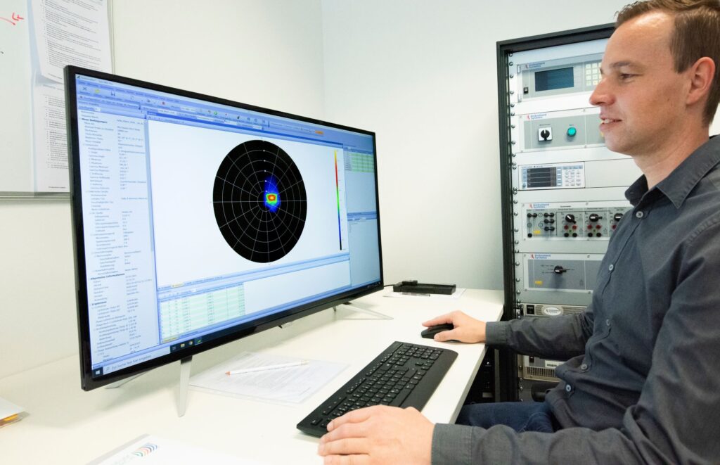 Goniophotometer for angle-dependent measurement of photometric properties of luminaires.